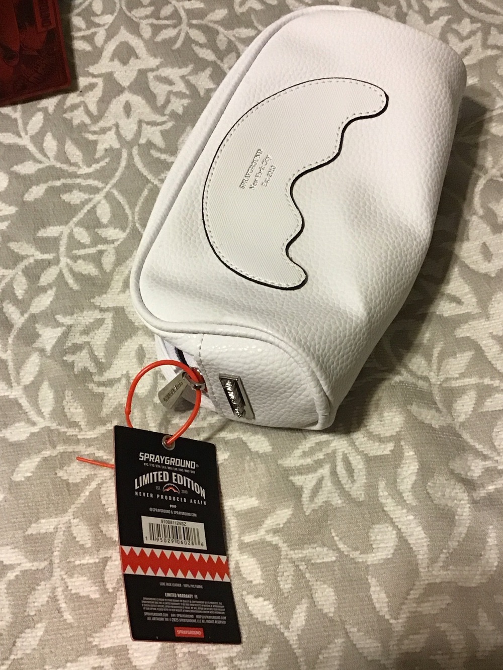 Sprayground White Pebbled Leather Wave Pouch with Red Tag Accent